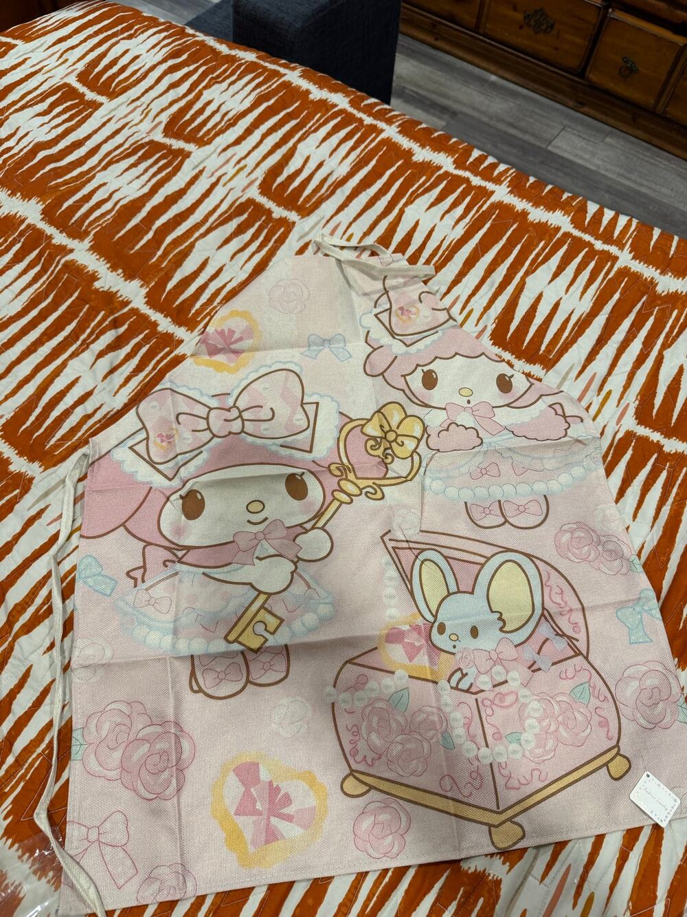Sanrio My Melody and friends  apron with pink background of roses and bows